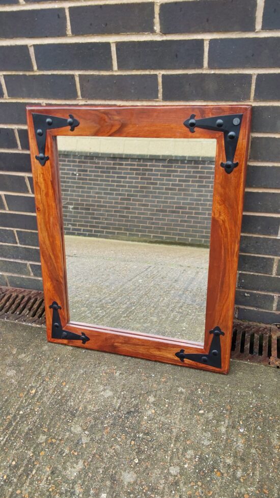 Mirror in decorative wooden frame